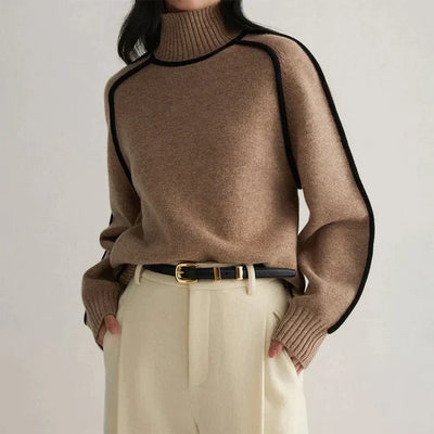 Model wears knitted brown jumper for winter with high cabbage. 