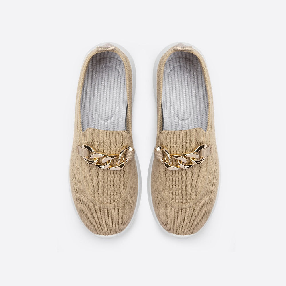 styled and breathable shoes with a gold button on top.